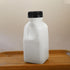Ipetboom 4pcs Commercial Reusable Drink Bottles for Milk and Juice, Plastic Sealed Beverage Containers with Black Lids