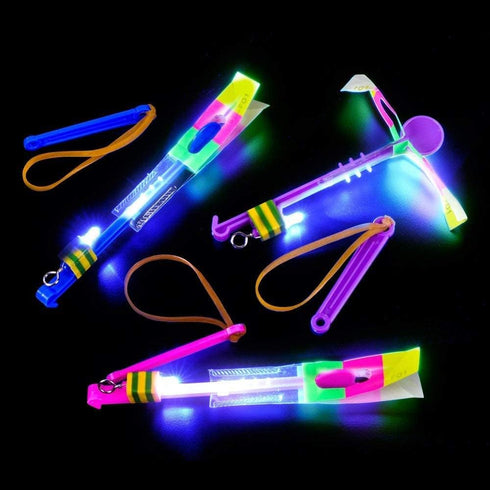 AMERICAN WIT 100 (2) Cool LED Light Up Helicopters (Multicolored) Slingshot Style Flying Toy Arrow Launch Flies up