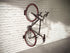 Monoprice On-Wall Rotating Vertical Bike Rack with Rear Tire Stop Tray, 66 lbs Capacity for Road and MTB Bikes