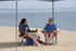 (146115) Quik Shade Chair Portable Folding Chair with Arm Rest Cup Holder and Carrying and Storage Bag, Red